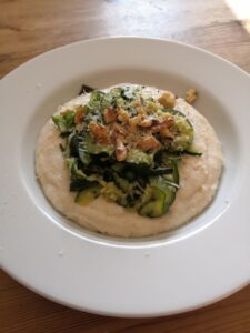 Herby courgettes and peas with semolina porridge