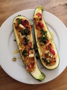 Stuffed courgettes with pine nut salsa